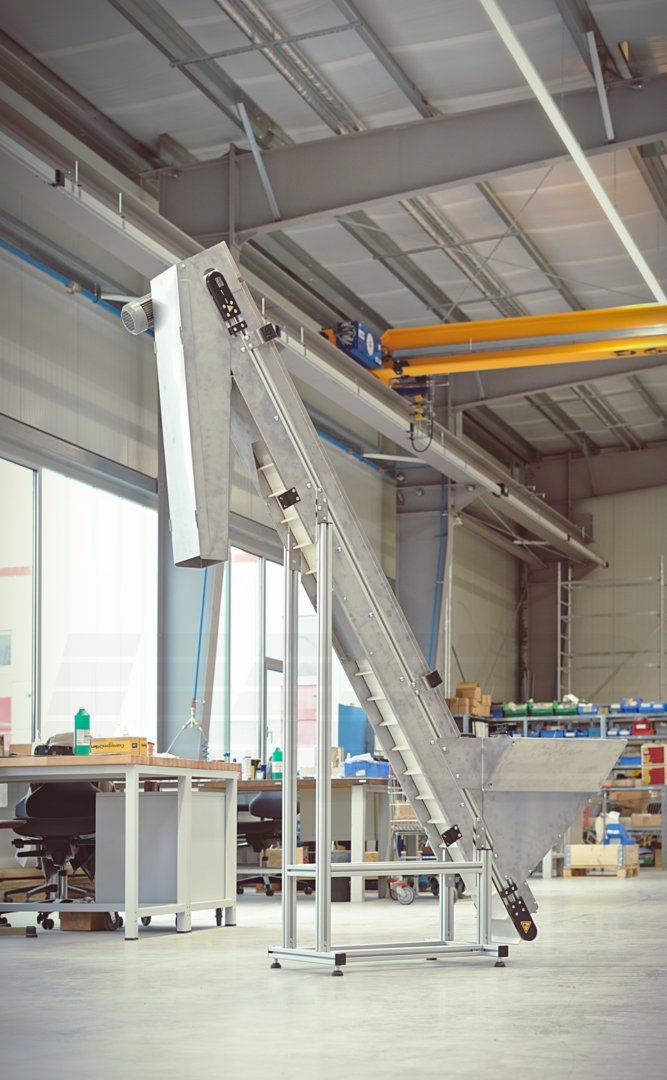 Minitrans Steigband mit Bunker Minitrans Steigband mit Stollengurt und vorgesetztem Bunker